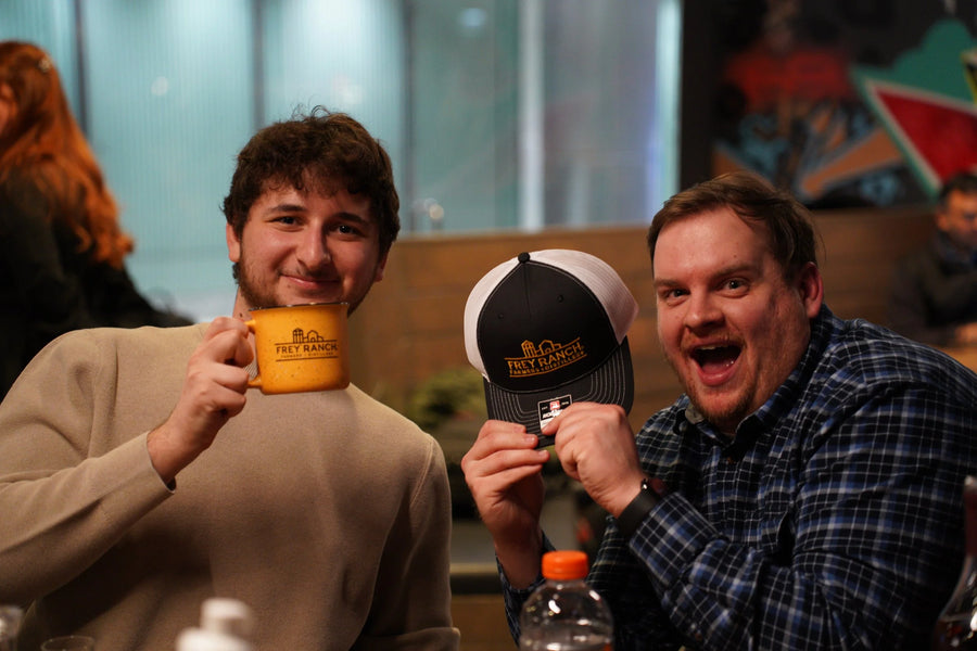 Trivia winners with Frey Ranch mug and hat