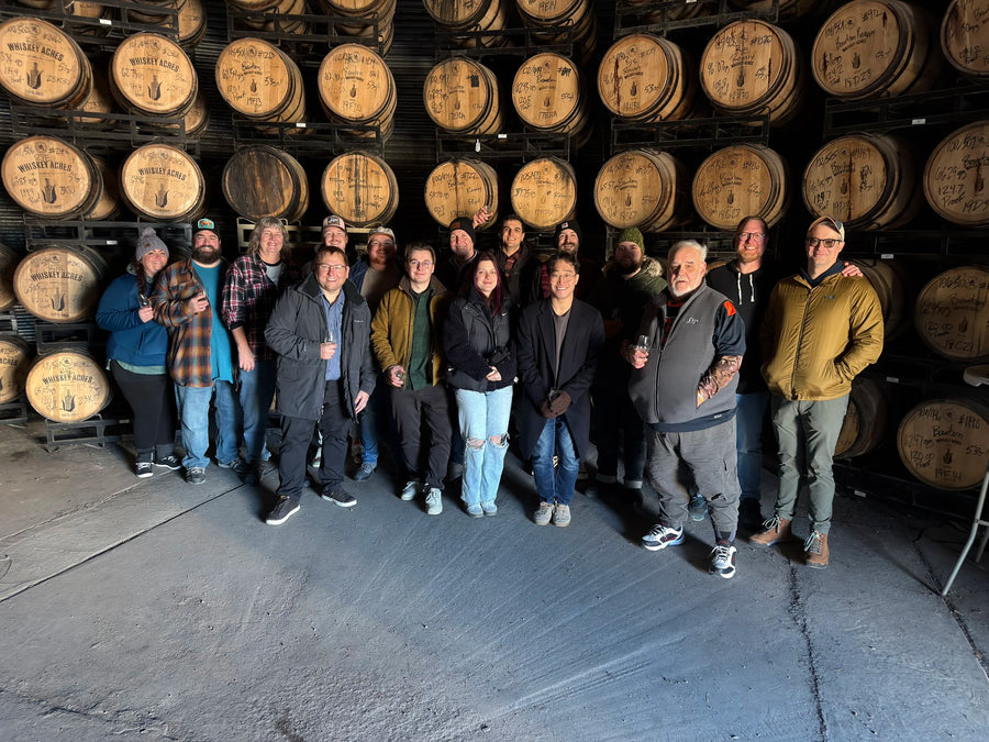 Collective members in the Whiskey Acres barrel warehouse